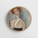 Red Headed Woman Wearing a Pendant